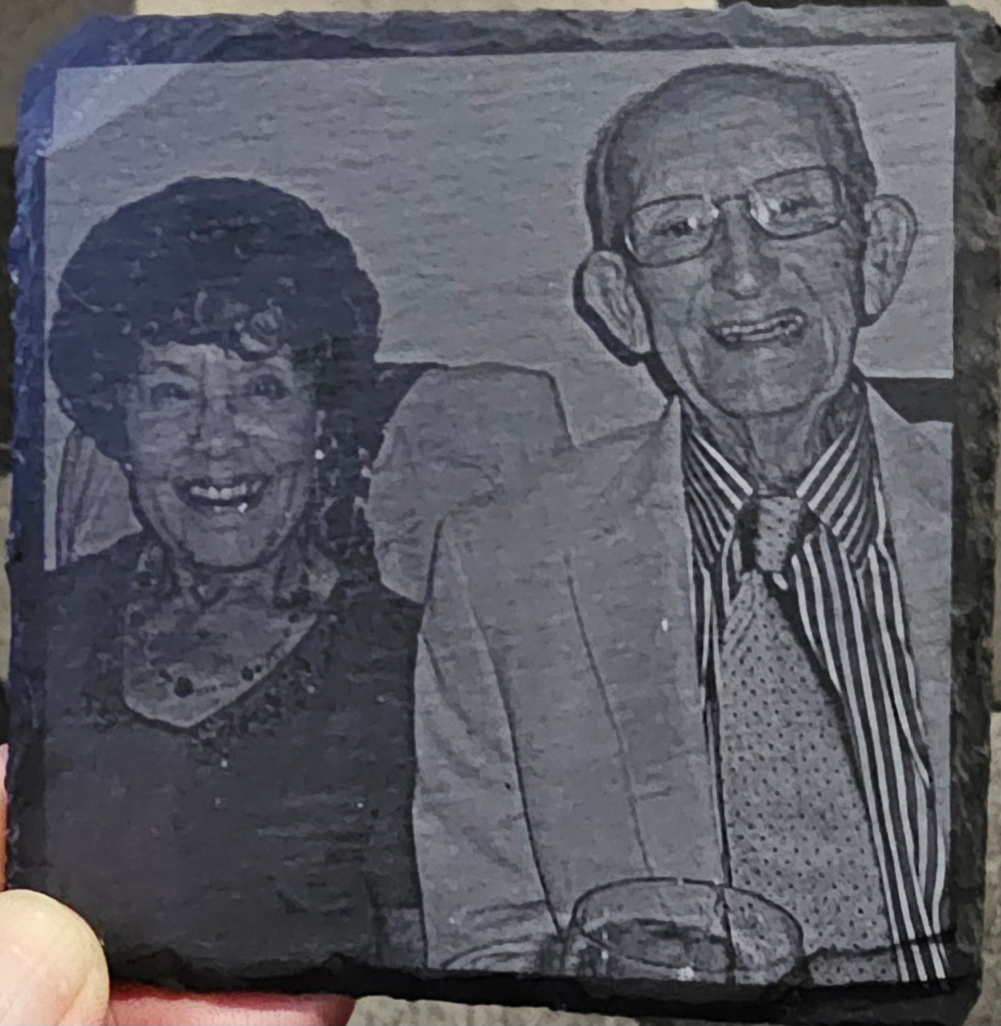 Engraved portrait  on a slate coaster.